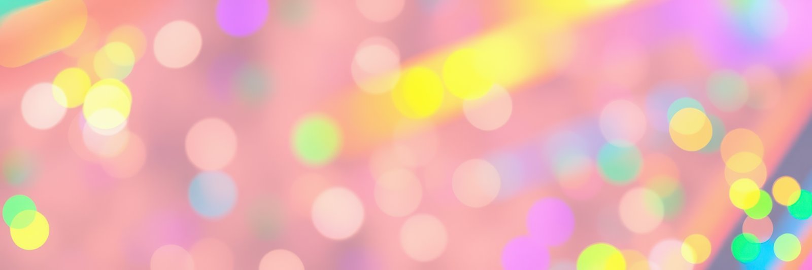 Colorful bokeh lights create a vibrant atmosphere in an abstract background setting at an evening event